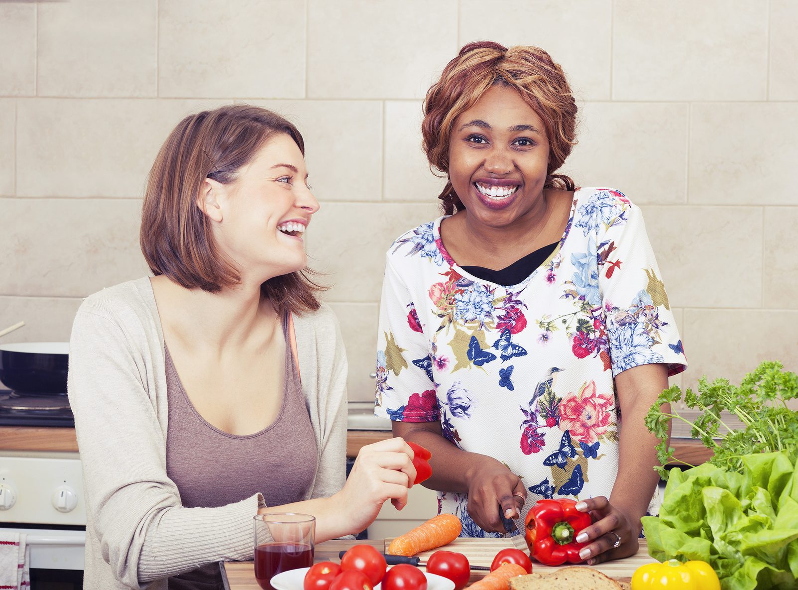 Happy friends cooking together